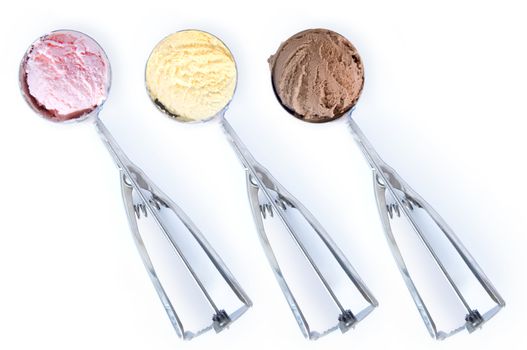 Three flavored ice cream scoops over a white background