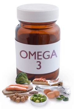 Omega 3 rich foods next to a pill jar over a white background