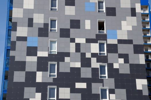 The new house revetted with a multi-colored granite tile in the city of Volgograd