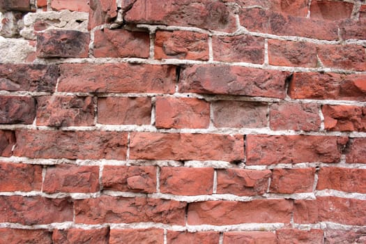 Element of the destroyed wall of the old house from a red brick