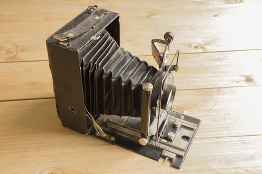 Vintage camera on the Brown wooden background