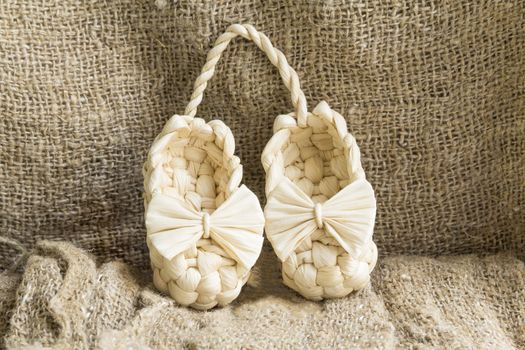 souvenir vintage Russian bast shoes amid Brown burlap