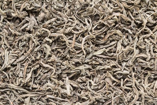 Background from dried leaves of Ceylon black tea close up