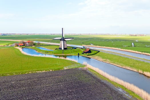 Traditional windmill in a dutch landscape in the Netherlands