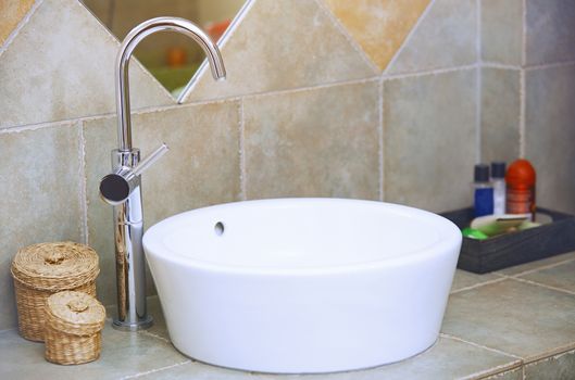 Water tap and sink in domestic bathroom