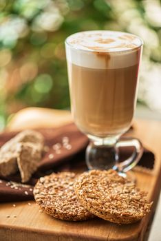 coffee latte cup with cookies closeup