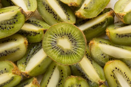 Fresh organic Kiwi Fruit Slices arranged showing the pips & structure