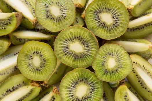 Fresh organic Kiwi Fruit Slices arranged showing the pips & structure