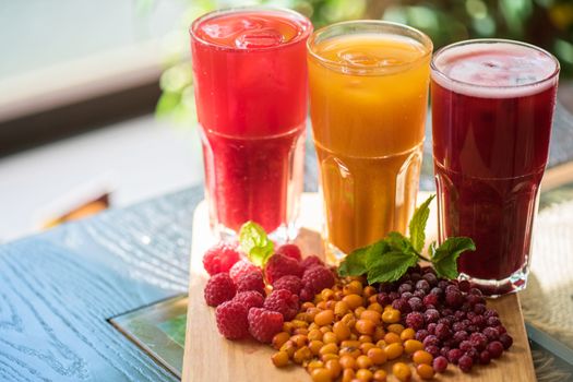 set of fruit non-alcoholic drink with cranberries raspberries and sea buckthorn
