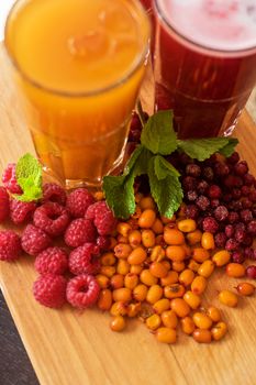 set of fruit non-alcoholic drink with cranberries raspberries and sea buckthorn
