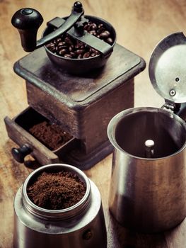 Photo of an Italian Moka Express stovetop coffee maker and a coffee grinder