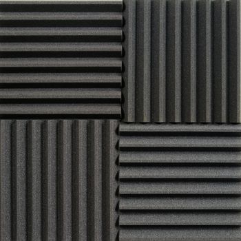 Background photo of recording studio sound dampening acoustical foam or tiles.

