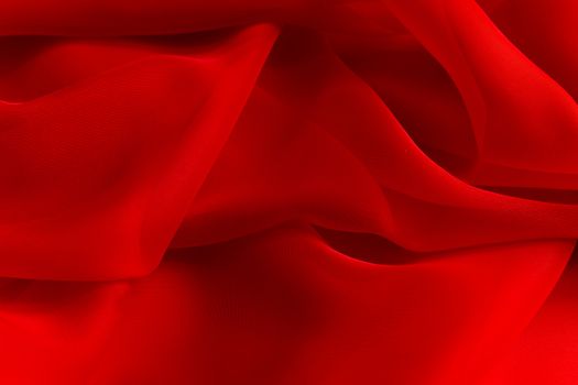 delicate Red silky fabric folds background texture