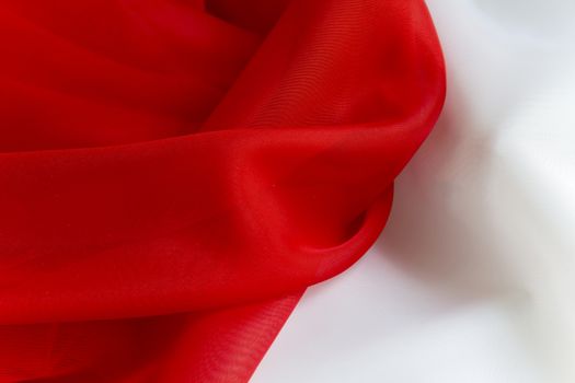 delicate Red on White silky fabric folds background texture