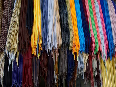 Display of bright colorful shoe laces in a shop   