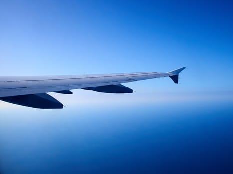 Airplane flying above clouds in clear blue sky great travel transportation background image 