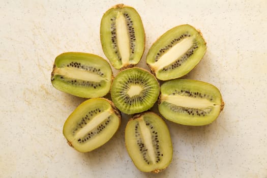 Fresh organic Kiwi Fruit Slices arranged showing the pips & structure
