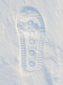 Image of footprint in snow.