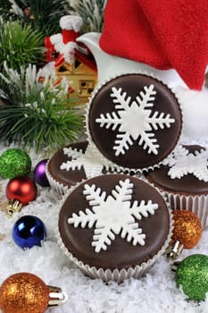 Chocolate Christmas Muffins decorated with marzipan pearl snowflake