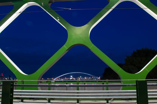 On the place of the oldest bridge in Bratislava, Slovakia, new opened Old Bridge for the trams and pedestrians. Details of the bridge in the night light.