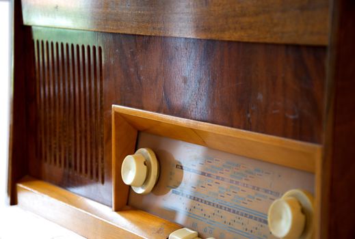 Retro wooden vinyl gramophone isolated on white.