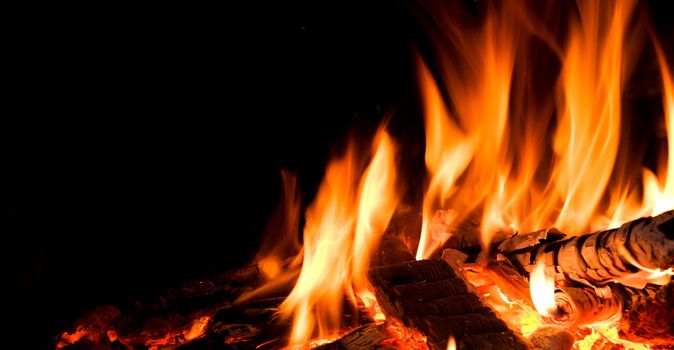 Detail of fire in open fireplace.