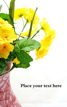 Yellow imitation of flower in old ceramic vase.