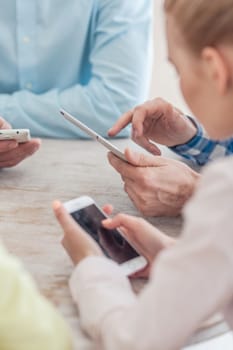 Group of diverse people using digital devices