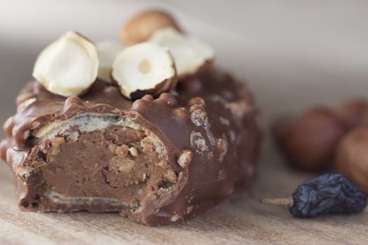 chocolate desert with nuts, raisin on wooden table