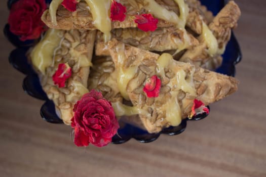 cookie with honey and flowers, wooden table