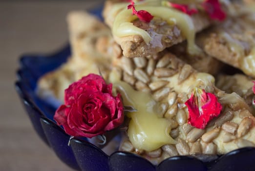 cookie with honey and flowers, wooden table