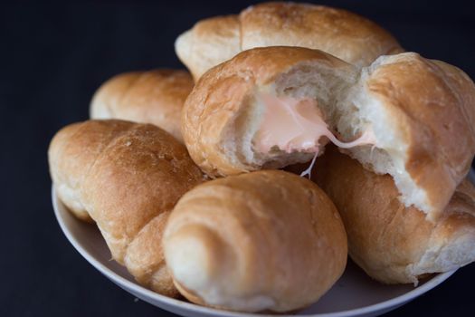 french tasty, fresh croissans on dark background