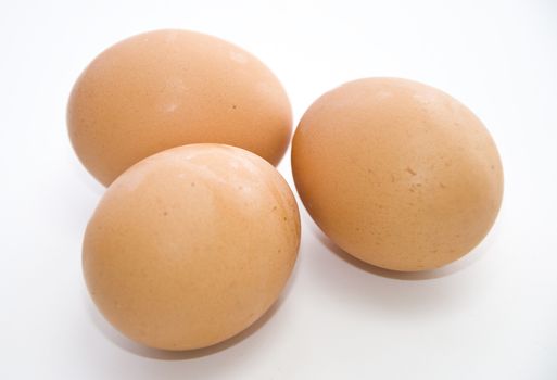 Three eggs on the white background.