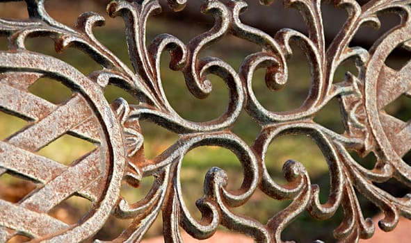 Detail of rusty pattern in the park bench.