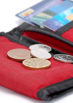 Detail image of red wallet with cards and coin.