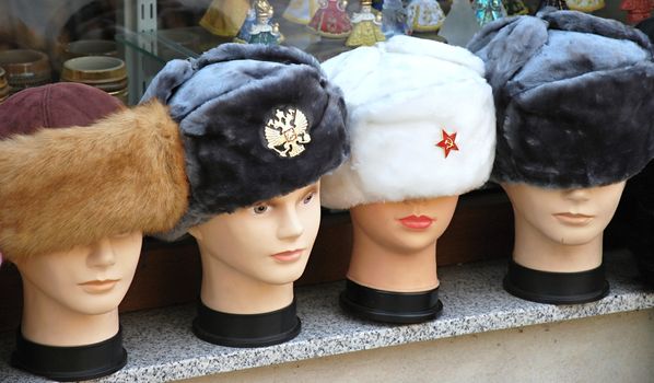 Detail of plastic heads with caps in various colors.