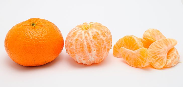 Detail image of mandarine isolated on the white background.