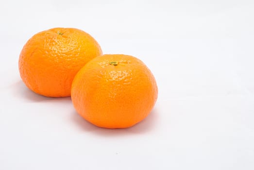 Detail image of mandarine isolated on the white background.