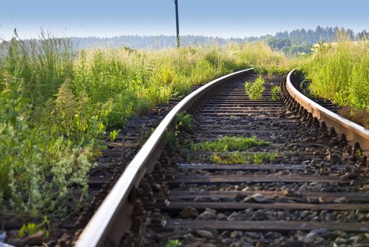 Detail image of railway on the meadow.