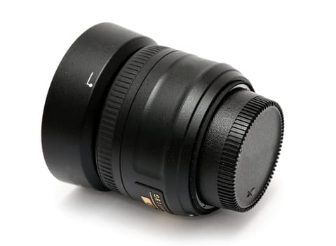 Closeup image of black lens placed on the white background.