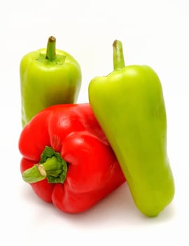 Red and green pepper placed on the white background.