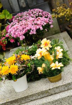 Funeral flowers placed on the grave at All souls holiday.