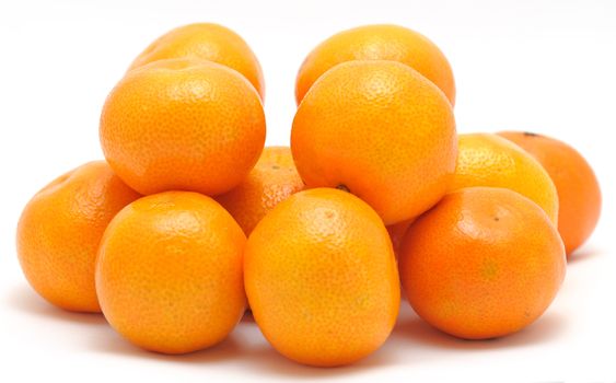 Stack of mandarines placed on the white background.