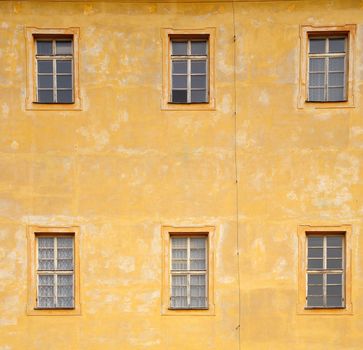 Side of house with many windows.