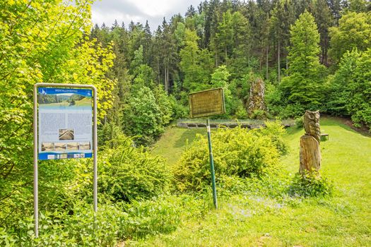 Steinheim, Germany - May 26, 2016: Wental valley dam - Wental educational trail signpost showing infos about the reservoir dam, Swabian Alps (Schwaebische Alb)