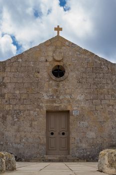 St. Mary Magdalene Chapel was rebuilt on the cliff edge in the seventeenth century. Located in Dingli at the mediterranean island Malta. Intense clouds.