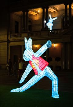 SYDNEY, AUSTRALIA - 7 FEBRUARY, 2016;  The rabbits on the lawn outside Customs House Sydney, practice tai chi or yoga.  The rabbit in the zodiac is associated with tame, tenderness. People in Rabbit sign are not aggressive but approachable. They have a decent, noble and elegant manner.
