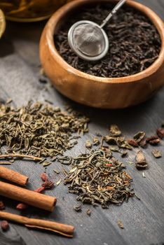 tea composition with cinnamon sticks, lemons