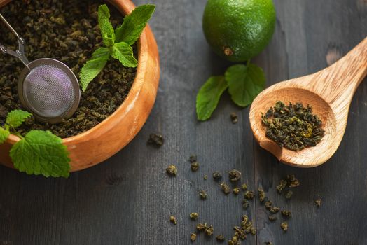 tea composition with cinnamon sticks, lemons