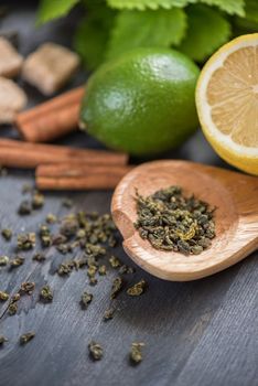tea composition with cinnamon sticks, lemons